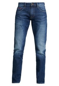 Vaqueros de mezclilla azul oscuro con corte recto, diseño de cinco bolsillos y un ligero desgastado en los muslos. Presentan un botón de metal y detalles de costura.