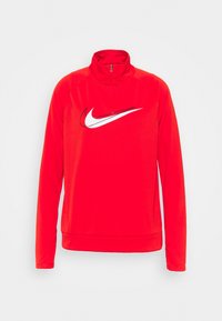 Röd Nike-tröja med hög krage, långa ärmar och en vit swoosh-logga på bröstet. Tillverkad av ett mjukt, elastiskt material.