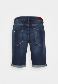 Dark blue denim shorts featuring a rolled hem, two back pockets, and a brown leather patch at the waistband. Subtle distressed detail.