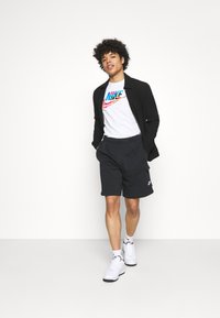 Nike Sportswear CLUB CARGO - Teplákové kalhoty - black