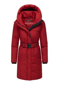 Red puffer coat with a high collar and oversized hood, cinched waist with a black belt, zippered front, and side pockets.