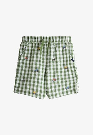 Grün-weiß kariert Kinder-Shorts mit kleinen, bunt bestickten Traktoren und einem elastischen Bund mit grünen Kordeln.