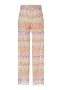 Mehrfarbige, ausgestellte Hosen mit einem Zickzackmuster in Orange, Lavendel, Grün und Creme. Der Stoff hat ein strukturiertes, leichtes Design.