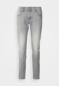 Jeans in denim grigio con una vestibilità slim, dotati di un classico design a cinque tasche, leggera scoloritura e chiusura anteriore con bottone.