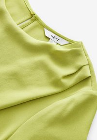 REGULAR FIT SHORT SLEEVE ASYMMETRIC - Blúzka - lime green