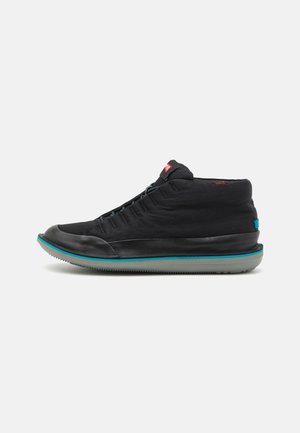 Black high-top sneaker with a smooth fabric upper, perforated detailing, and a contrasting teal rubber sole. Features a lace closure.