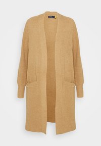 Lång cardigan i ett ljust brunt stickat tyg. Har en ribbad textur, öppen front, långa ärmar och två framfickor.