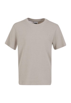 Beige ribbestrikket t-skjorte med rund hals og korte ermer. Laget av teksturert stoff, har den en rett passform og et minimalistisk design.