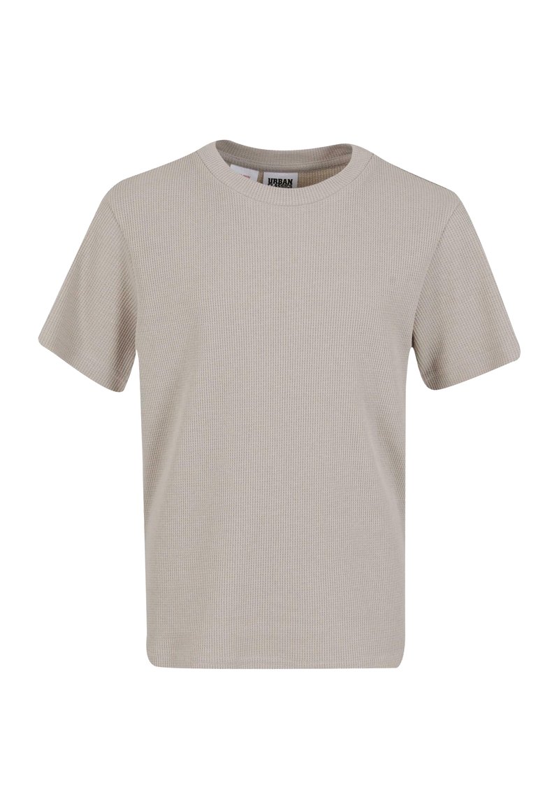 Béžové žebrované tričko s kruhovým výstřihem a krátkými rukávy. Vyrobeno z texturované tkaniny, má rovný střih a minimalistický design.