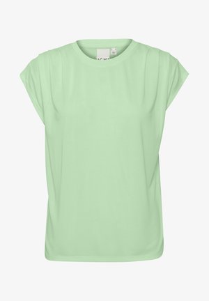 Mėtų žalios spalvos trumpomis rankovėmis marškinėliai su apvalia kaklo iškirpte, pasižymintys švelnia, lygiąja medžiaga ir subtiliomis susikaupimo detalėmis ant pečių.