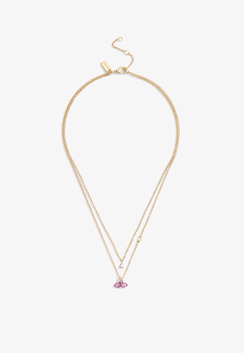 Collier superposé ton or avec deux chaînes fines, muni d'un pendentif nœud rose et d'une fermeture à boucle avec longueur ajustable.
