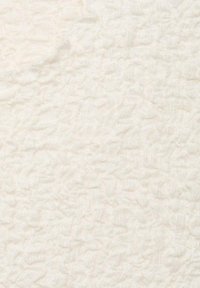 Off-white textured fabric with a crinkled pattern. The surface appears soft and lightweight with a subtle sheen.