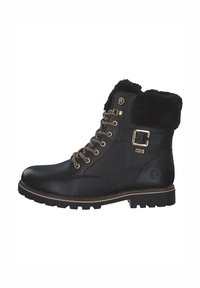 Bottine en cuir noir avec un col en fausse fourrure, quincaillerie dorée et lacets marron. Semelle à profil pour une meilleure adhérence ; finition texturée sur le dessus.