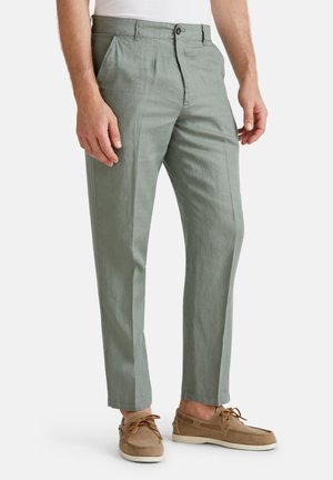 Lichtgroene linnen broek met een rechte pasvorm, voorzien van een knoopsluiting, zijzakken en een subtiele struktuurafwerking.