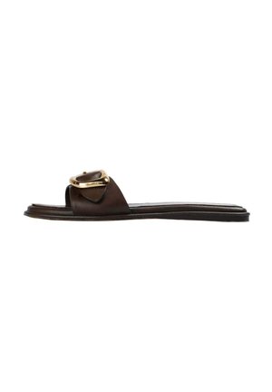 Brown leather slide sandal features a wide strap with a gold buckle detail, flat sole, and minimalistic design. Smooth texture.