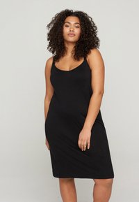 Black, sleeveless dress with a scoop neckline, made from soft fabric. It has a relaxed fit and falls just above the knees.