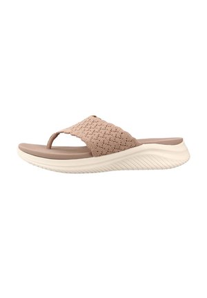 Sandalia beige sin cierre con tira de tela texturizada, plantilla acolchada y suela blanca gruesa con ranuras, diseñada para uso casual.