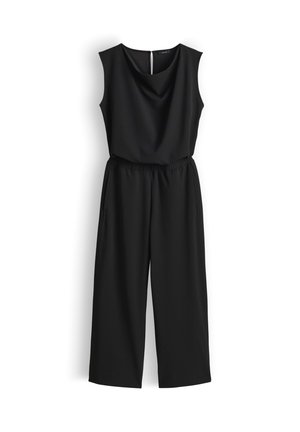 Tuta nera senza maniche con vita elastica, gambe larghe, scollo rotondo e chiusura con bottoni sul retro, appesa su sfondo bianco.