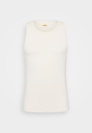 Hvit bomullstopp med rund hals og tettsittende design. Glatt tekstur, ermeløs modell og rett kant. Minimalistisk stil.