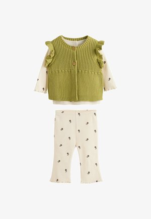Green knitted sleeveless vest with buttons over cream floral long-sleeve top and matching ribbed floral pants for toddler.