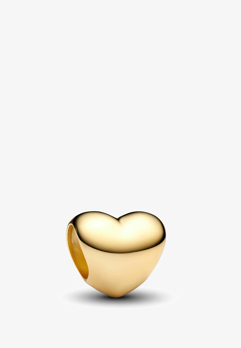 Perla a forma di cuore in oro, superficie liscia con una finitura lucida, parte superiore arrotondata e parte inferiore aperta. Nessun motivo o accentuazione visibili.