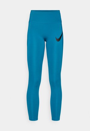 Blue high-waisted leggings made from stretch fabric, featuring a sleek design and a black Nike logo on the left thigh.
