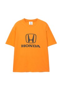 Orange bomulds T-shirt med et sort Honda-logo og tekst i midten. Korte ærmer og rund halsudskæring; afslappet pasform.