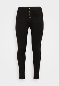 Jeans skinny negros con una cintura alta, cierre de cinco botones y dos bolsillos frontales. Hechos de denims con una textura suave.