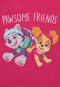 Cartoon graphic featuring a purple wolf and orange dog on a pink background. Text reads "PAWSOME FRIENDS." Characters have playful expressions.