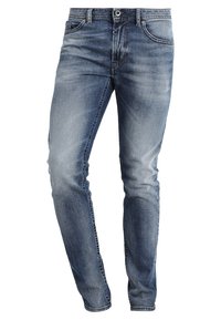 Blå denimjeans med rak skärning, i en urtvättad tvätt, fem fickor och bältesöglor. Metallknapp och dragkedjestängning fram.