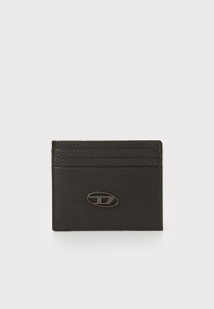 Black leather cardholder with a textured surface, featuring multiple slots and a metal logo accent. Simple, rectangular design.