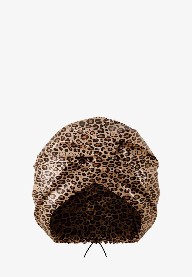 Haartrocknerhaube mit Leopardenmuster aus weichem, strukturiertem Material mit Kordelzugverschluss. Braune Basis mit schwarzen und hellbraunen Punkten.