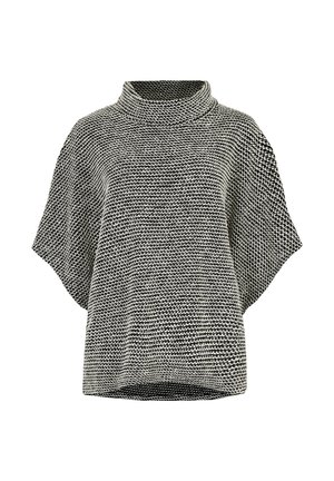 Pull en tricot noir et blanc avec un col montant, des manches courtes, une coupe ample et un motif texturé sur l'ensemble.