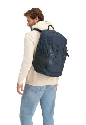 Navy backpack with black accents, featuring adjustable straps, a front bungee cord, and zippered compartments; made of durable fabric.