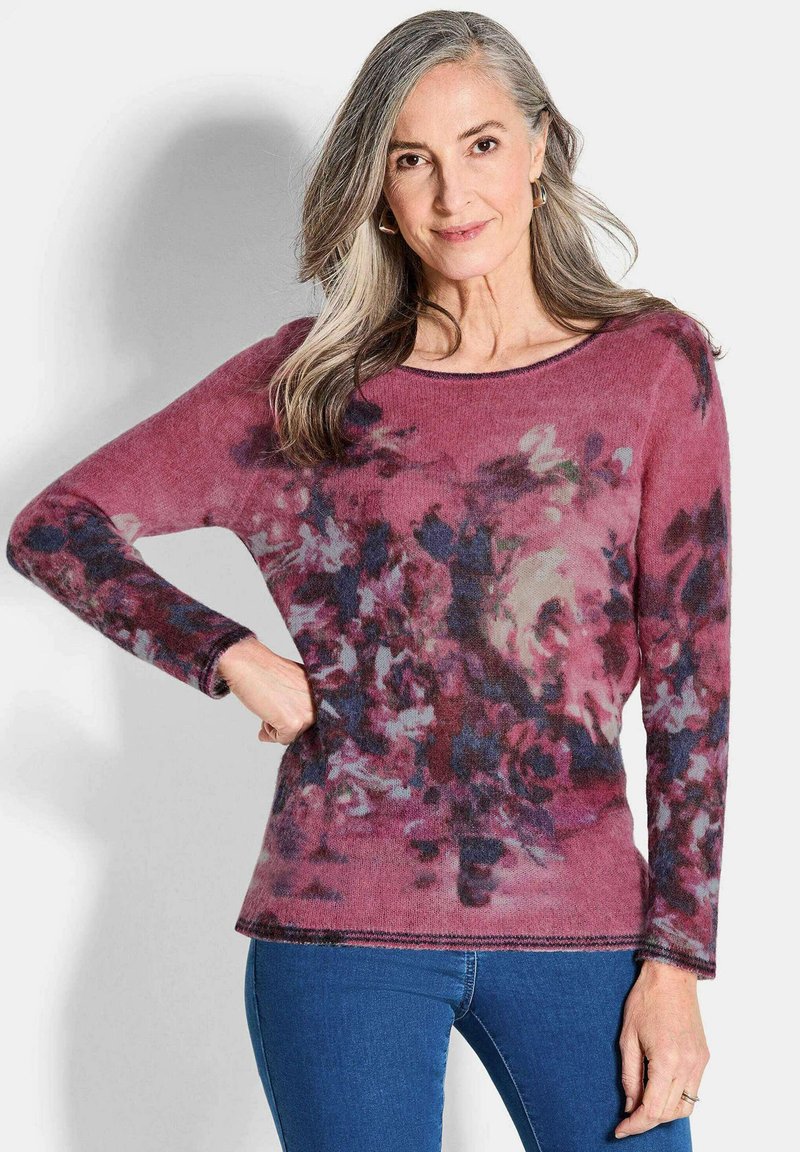 Lila- und rosa-blumendesign Pullover mit langen Ärmeln, Rundhalsausschnitt und gerippten Bündchen, gefertigt aus einem weichen, strukturierten Stoff.