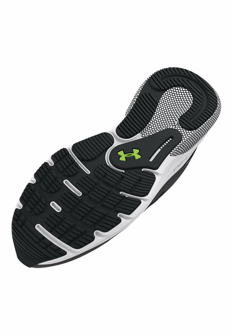 Sole di scarpa atletica in bianco e nero con un motivo di battistrada testurizzato, dettagli di imbottitura e un piccolo logo verde.