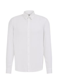 Camicia bianca a maniche lunghe con bottoni, realizzata in tessuto liscio, dotata di colletto classico, piastra frontale con bottoni e maniche a taglio dritto.