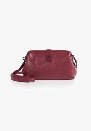 Burgundy leather crossbody bag with a rounded shape, top zipper, and a detachable strap. Features a front tab closure and embossed logo detail.