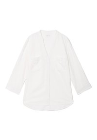 Chemise en coton blanche à manches longues avec un col en V, deux poches poitrine et une coupe décontractée. Elle présente une fermeture à boutons à l'avant et un ourlet arrondi.