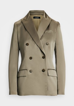 Dwurzędowa beżowa marynarka wykonana z gładkiego satynowego materiału. Posiada duże okrągłe guziki, dwie przednie kieszonki i klapowany kołnierz.