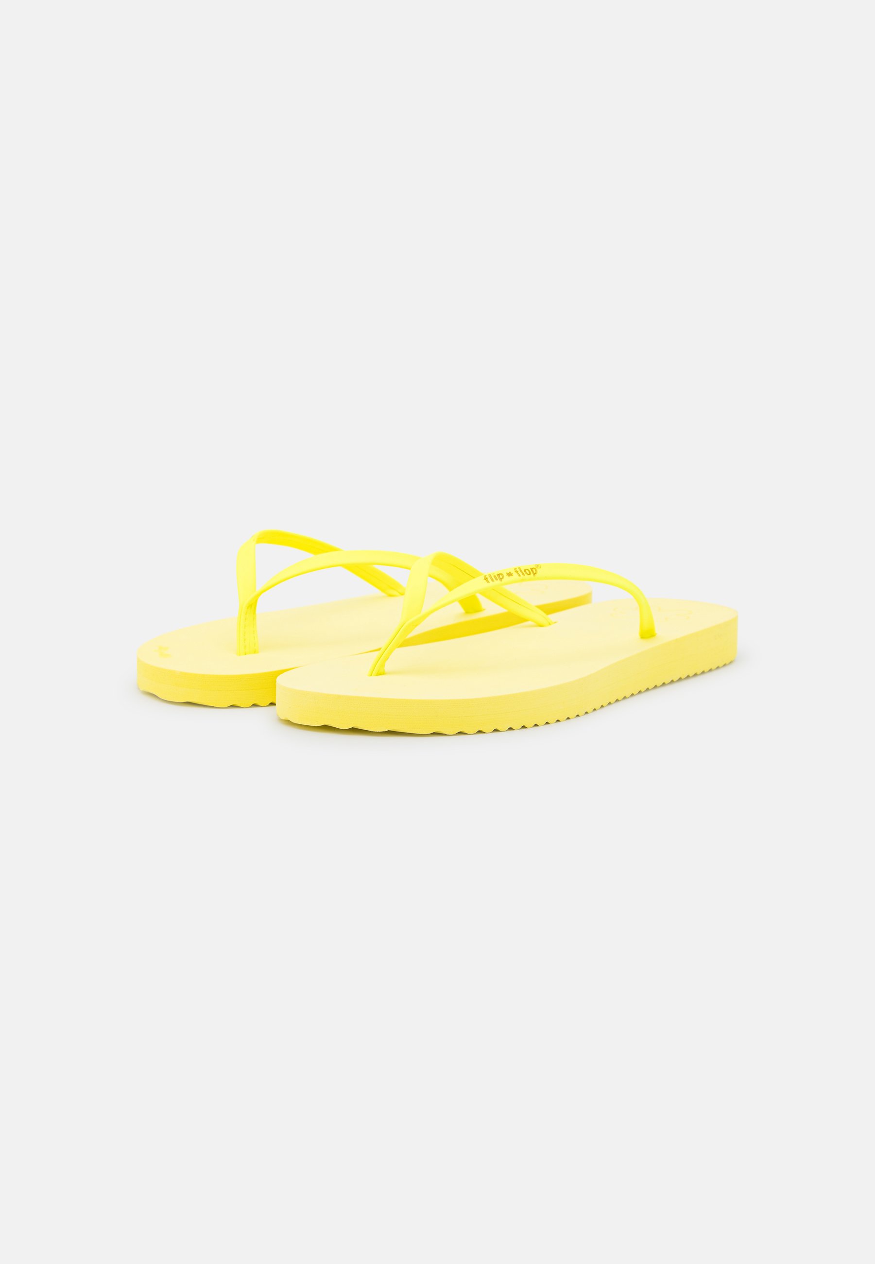 neon yellow flip flops