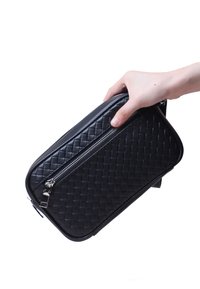 Black woven leather bag with a rectangular shape, featuring a zipper closure, smooth texture, and a side handle for easy carrying.