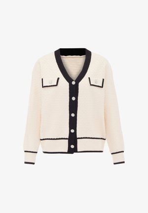Cardigan crema con bordi neri, caratterizzato da una superficie testurizzata, due tasche frontali e bottoni decorativi che assomigliano a design floreali.