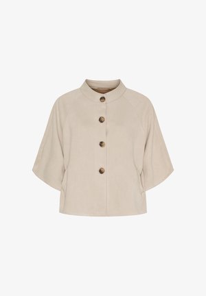 Beige kortærmet jakke med ståkrave og fire store brune knapper foran, med en løs, boxy pasform.