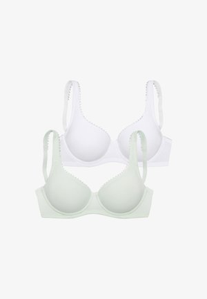 Two smooth-cup bras, one white and one light green, each with adjustable straps and scalloped trim along the edges.