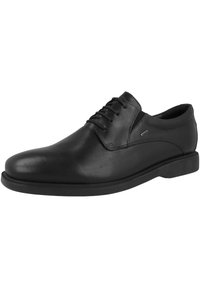 Scarpe da uomo in pelle nera con finitura liscia, punta tonda, lacci a sei occhielli e suola in gomma bassa. Hardware minimo e senza motivi visibili.