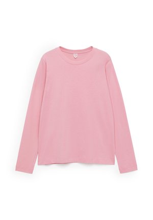 Langarmshirt in hellrosa, aus weicher Baumwolle. Mit rundem Halsauschnitt und lockerer Passform mit geraden Säumen. Einfaches Design, ohne Muster.