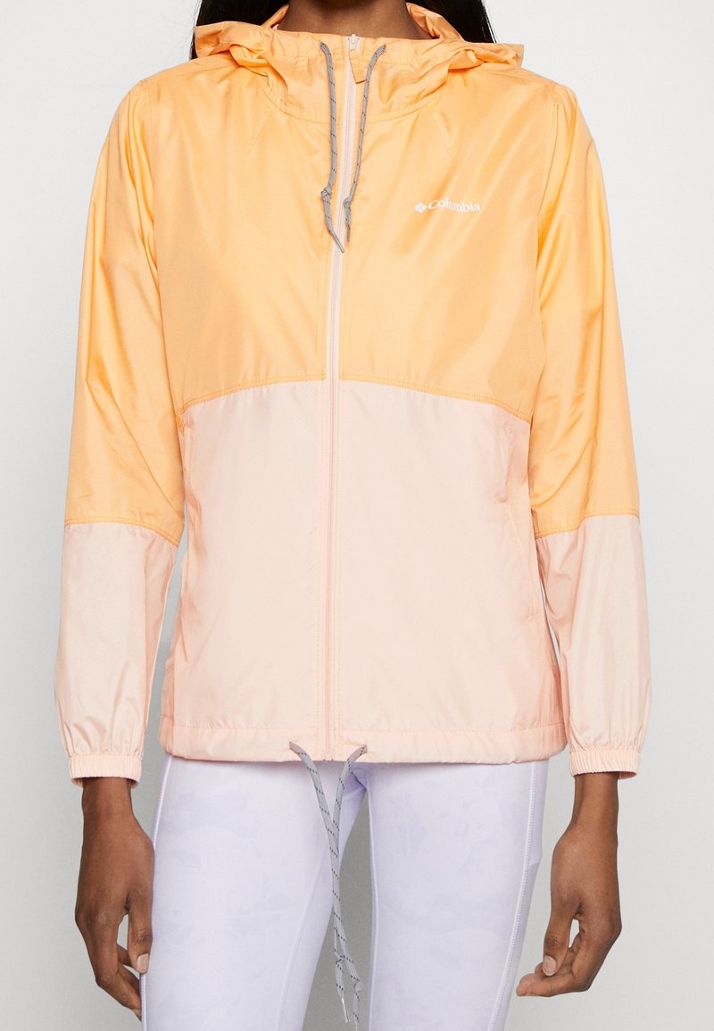 Lightweight, two-tone jacket features a bright peach upper and a lighter peach lower section, with a drawstring hood and elastic cuffs.