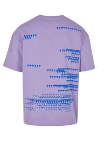 Purple cotton t-shirt with a relaxed cut, featuring a blue abstract pattern of question marks on the back, smooth texture, and crew neckline.