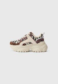 Chunky sneakers with a multicolor animal print in shades of black, orange, and pink; cream-colored rubber sole and textile upper.